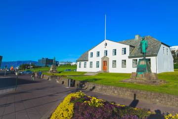 Street scene street in downtown Reykjavik, Iceland, leading to the Hallgrimskirkja Church, one of...