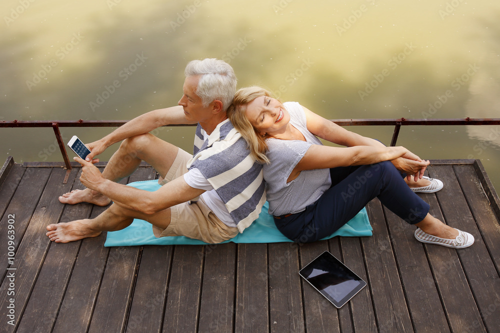 Wall mural Senior couple relaxing outdoor