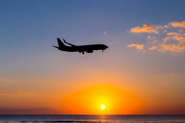 airplane silhouette on a sunset background
