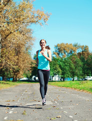 Fitness young woman running in park, female runner workout - spo