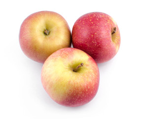 Apples with a red tint on a white background