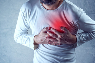 Severe heartache, man suffering from chest pain, having painful - Powered by Adobe