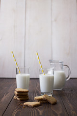 Milk and cookies for breakfast on a wooden background