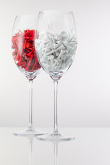 Two glasses of wine and golf equipments