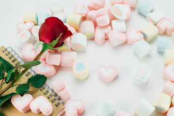 marshmallows candy with red rose and book vintage colour style