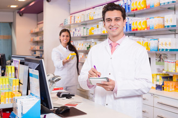 Pharmacist and assistant working