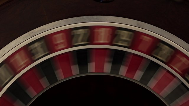 Classic roulette spinning fast black background
