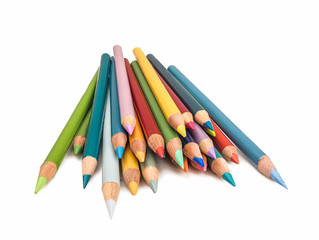 Photograph of a pile of colored pencils with their points toward the camera isolated on a white background.