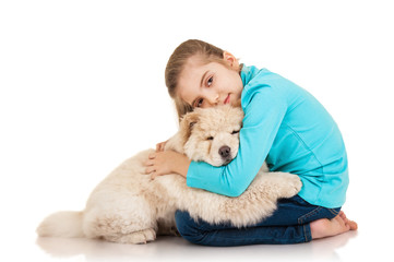 Little girl with chow-chow puppie isolated on white background