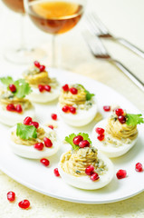 Blue cheese deviled eggs with pomegranate