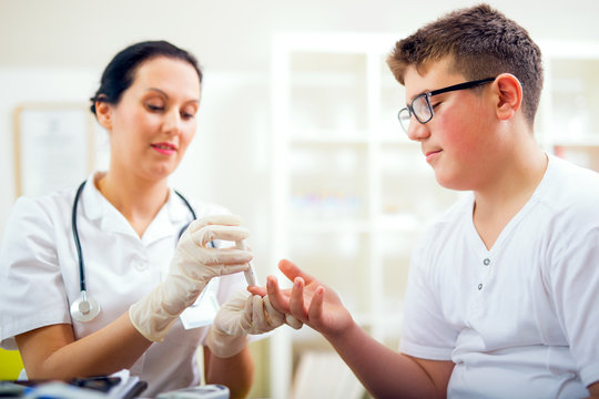 Measure child glucose level blood test diabetes little boy using glucometer