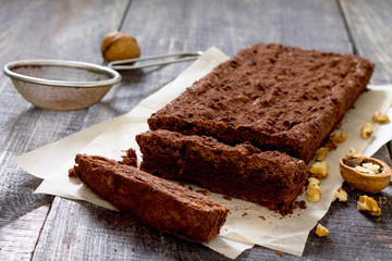 Chocolate brownie cake on a dark wooden table