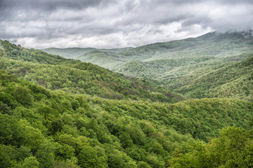 Naklejka na ściany i meble Spring landscape with Caucasus green mountains