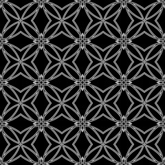 Fototapeta premium Seamless pattern in arabic style. Intersecting curved elegant lines and scrolls forming abstract floral ornament. Arabesque.