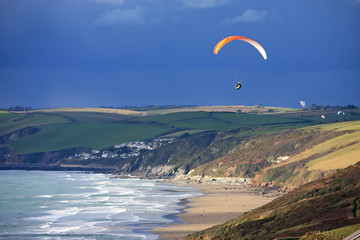Paragliders over Whitsand Bay