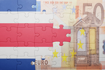 puzzle with the national flag of costa rica and euro banknote