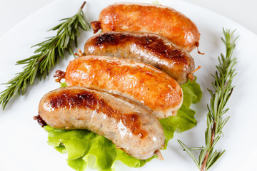 Roast beef or chicken sausage on a plate