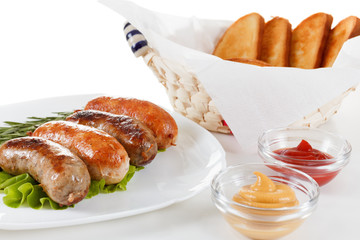 Roast beef or chicken sausage on a plate