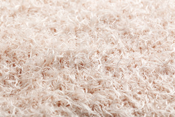 Knitted woolen fabric background, close up