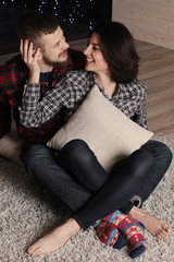 tender couple in casual clothes,posing at cozy home