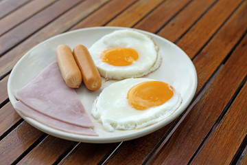 breakfast meal with ham sausage and egg