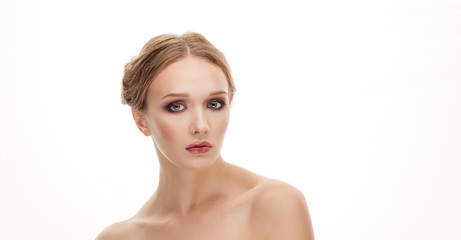 Beauty portrait of young adorable blonde woman with makeup and bare shoulders