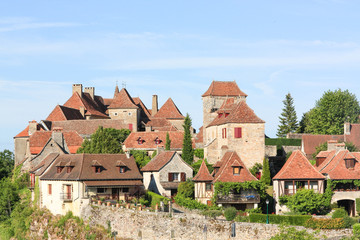 Loubressac,  Lot, one of the Plus Beaux Villages of France, in evening light with its medieval stone architecture and fortified chateaux