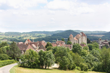 Fototapeta na wymiar Medieval fortified village of Curemonte, Correze, Limousin, France, with its three chateaux and one of the listed Most Beautiful Villages of France
