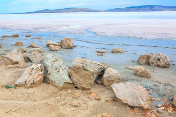 salty lake with big  stones