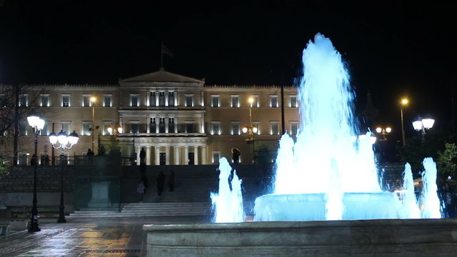 Platia Syntagma fountain night /
An iconic clip of Platia Syntagma fountain, in the hearth of Athens, Greece shot at night with Parliament Palace on the background
