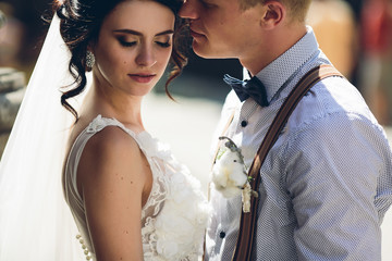 The bride and groom posing