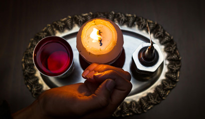 Havdalah candle wax . Jewish ceremony Saturday night © natushm
