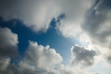 Fototapeta na wymiar Beautiful blue sky with fluffy white clouds background