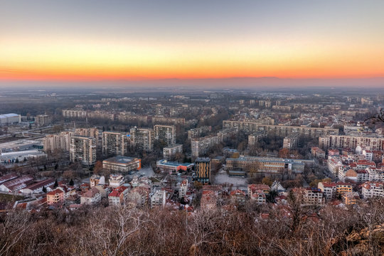 Panoramic Sunset view of city of Plovdiv from Dzhendem tepe hill, Bulgaria