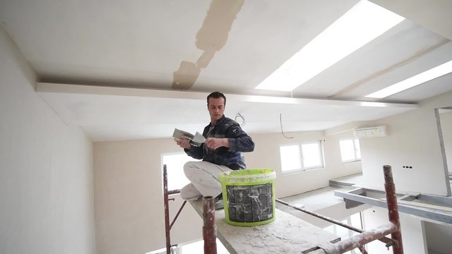 painter man at work, painter house concept, getting walls right and putting glue