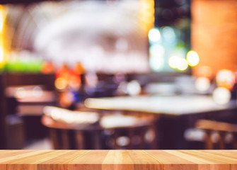 Empty wooden plank  table with blur restaurant background,Mock u