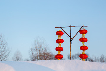 Eight Chinese lanterns on a snow hill