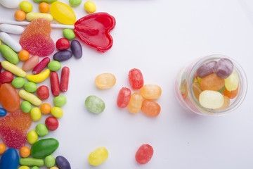 Fototapeta na wymiar Multicolor candies in glass jars