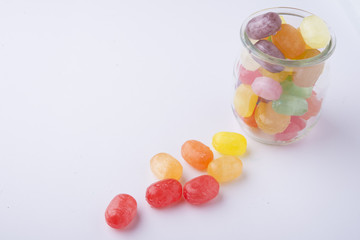 Multicolor candies in glass jars