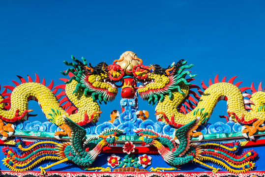 Chinese dragon on blue sky background. 