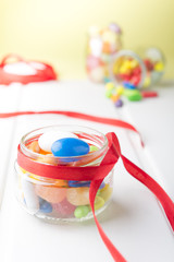 Multicolor candies in glass jars