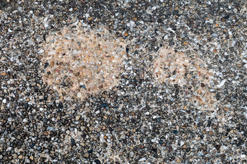 White walls with  pebbles and black stains