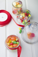 Multicolor candies in glass jars