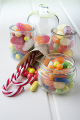 Multicolor candies in glass jars