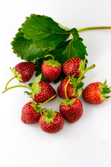 Ripe strawberries with leaves isolated on a white background