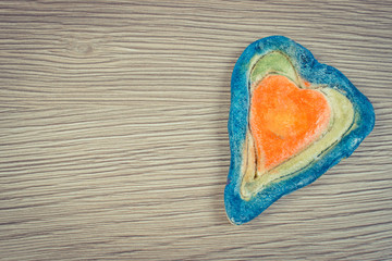 Obraz premium Vintage photo, Valentine heart made of salt dough, symbol of love, copy space for text