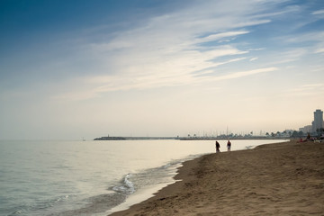 Family Walk At The Beach
