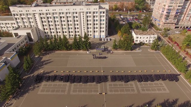 Police Academy. Recruits Standing on the parade ground. Aerial.Police Academy. Aerial filming