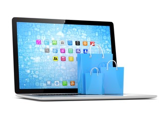 laptop and  shopping pags on white background