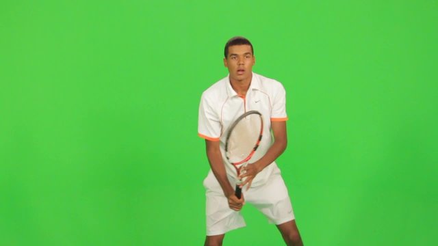 Professional tennis player makes different types of shots on a green screen.Session with professional tennis player